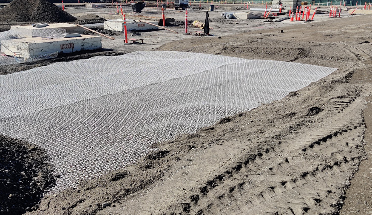 Geogrid being placed at a construction site in California.